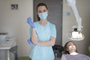 Dentist in Addison with personal protective equipment.