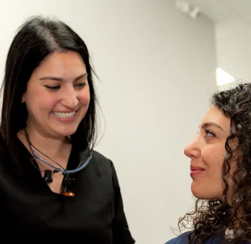 Dr. Saremi with a patient