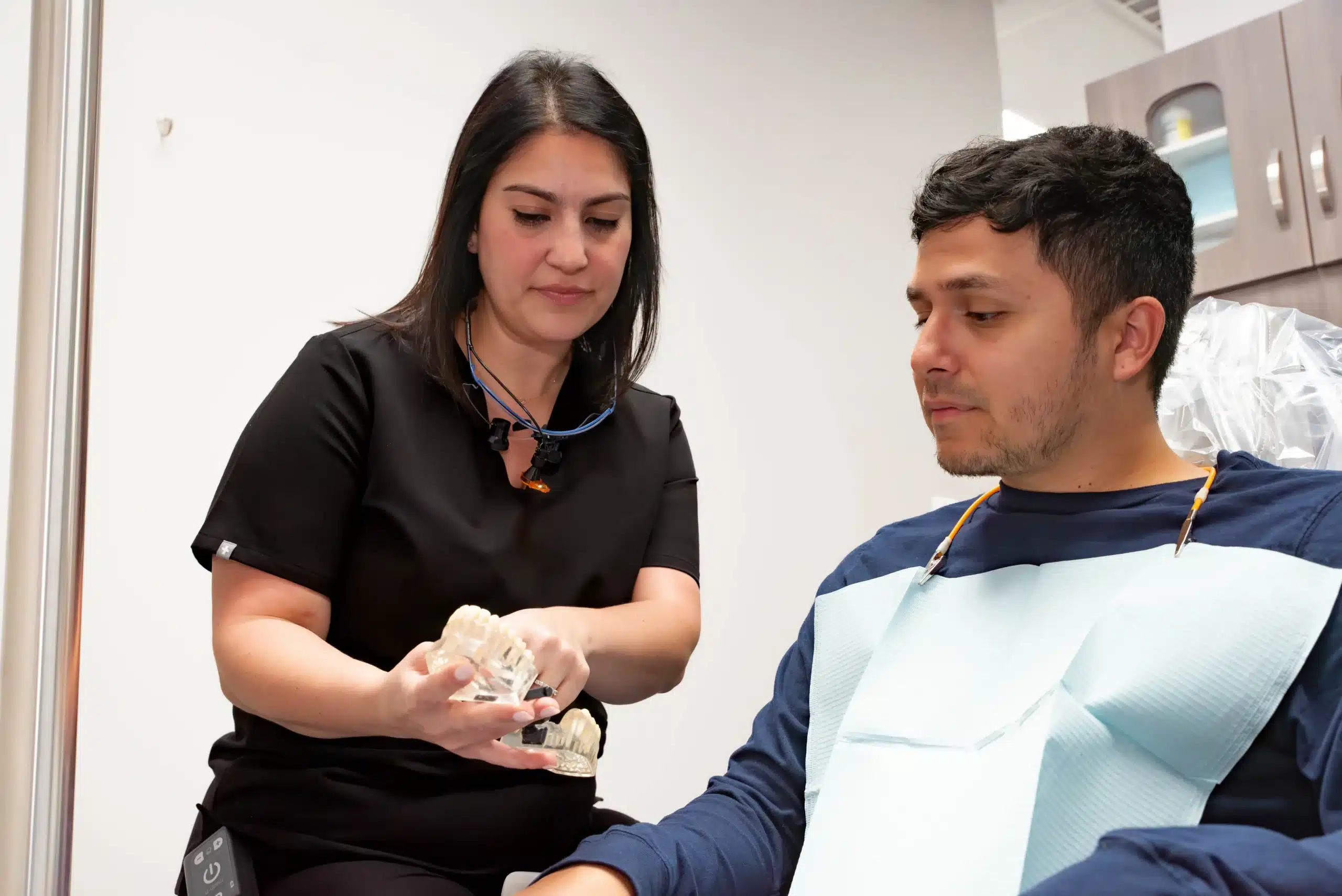 Doctor educating about missing teeth solutions